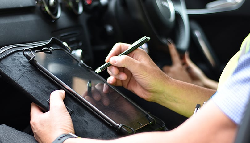 DVSA Examiner with tablet